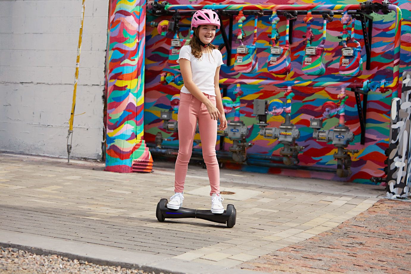Child riding Black Fluxx FX3 Hoverboard for Kids with LEDs